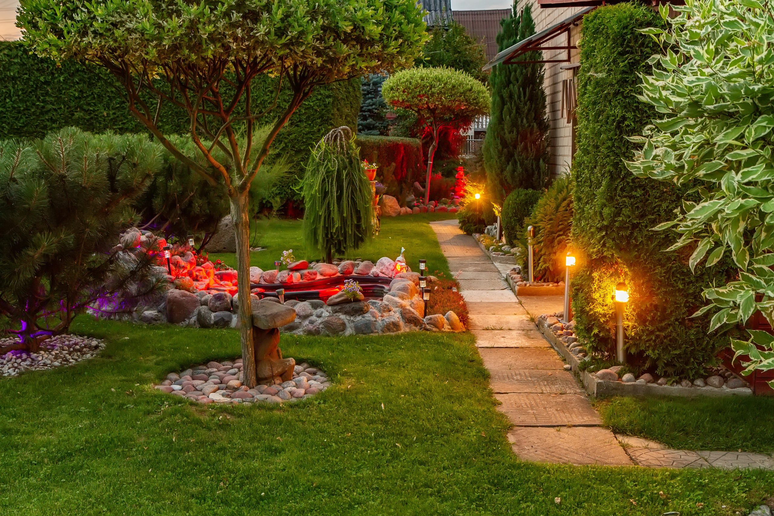 Simple stake lights line a small garden pathway.